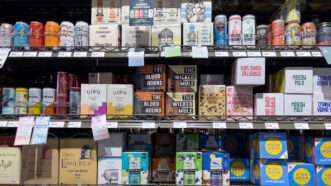 A grocery aisle with various boxes of canned cocktails | Photo 268982304 © ColleenMichaels | Dreamstime.com