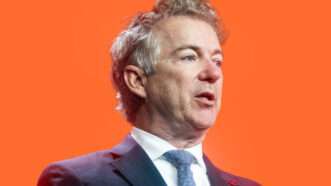 Senator Rand Paul in front of orange background | Lex Villena