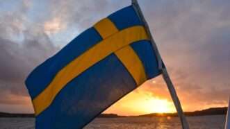 A Swedish flag waving in the wind in front of a sunset. | Photo by <a href=%40simonclare1c827.html Clare</a> on <a href=a-blue-and-yellow-flag-on-a-boat-in-the-water-zx8pwng2wui9678.html
				/></noscript>
			</picture>
		</div>
					</a>
					</div>
		<div class=