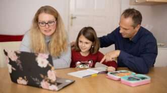 A mother and father sit with their young daughter at a table, looking at an open laptop, with an open book and an open case of colored pencils on the table. | Photo by <a href=%40sofatutorac9d-2.html on <a href=woman-in-blue-sweater-beside-girl-in-blue-sweater-4syo0fp1bf09678-2.html
				/></noscript>
			</picture>
		</div>
					</a>
					</div>
		<div class=