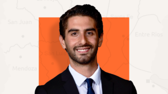 Marcus Falcone in front of orange square background | Lex Villena